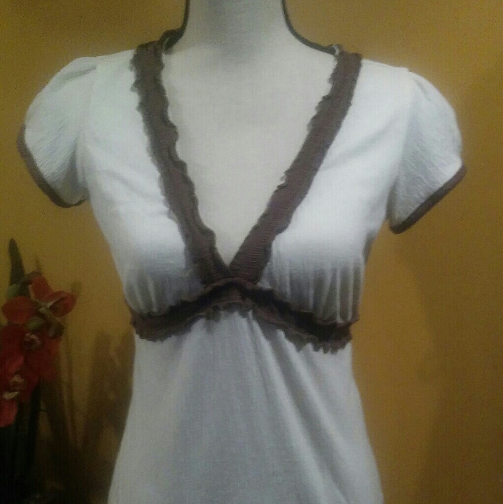 Cream and brown short sleeve v neck top.